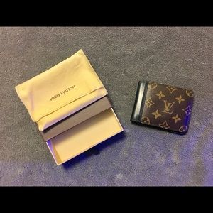 Louis Vuitton “Gaspar” bi-fold wallet.